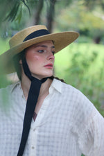 Load image into Gallery viewer, Grosgrain Amal the wide-brimmed natural straw boater hat with chin strap ribbons
