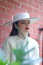 Load image into Gallery viewer, Grosgrain white wool felt wide-brimmed boater  with chin strap ribbons
