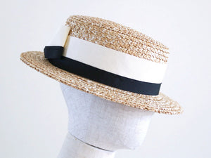 A classic boater hat with two colour Grosgrain